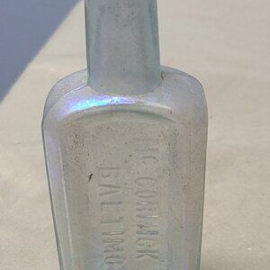 Vintage McCormick & Co rainbow iridescent glass medicine bottle